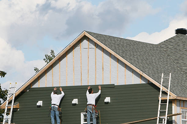 Professional Vinyl Siding technician working in Bedford, MA
